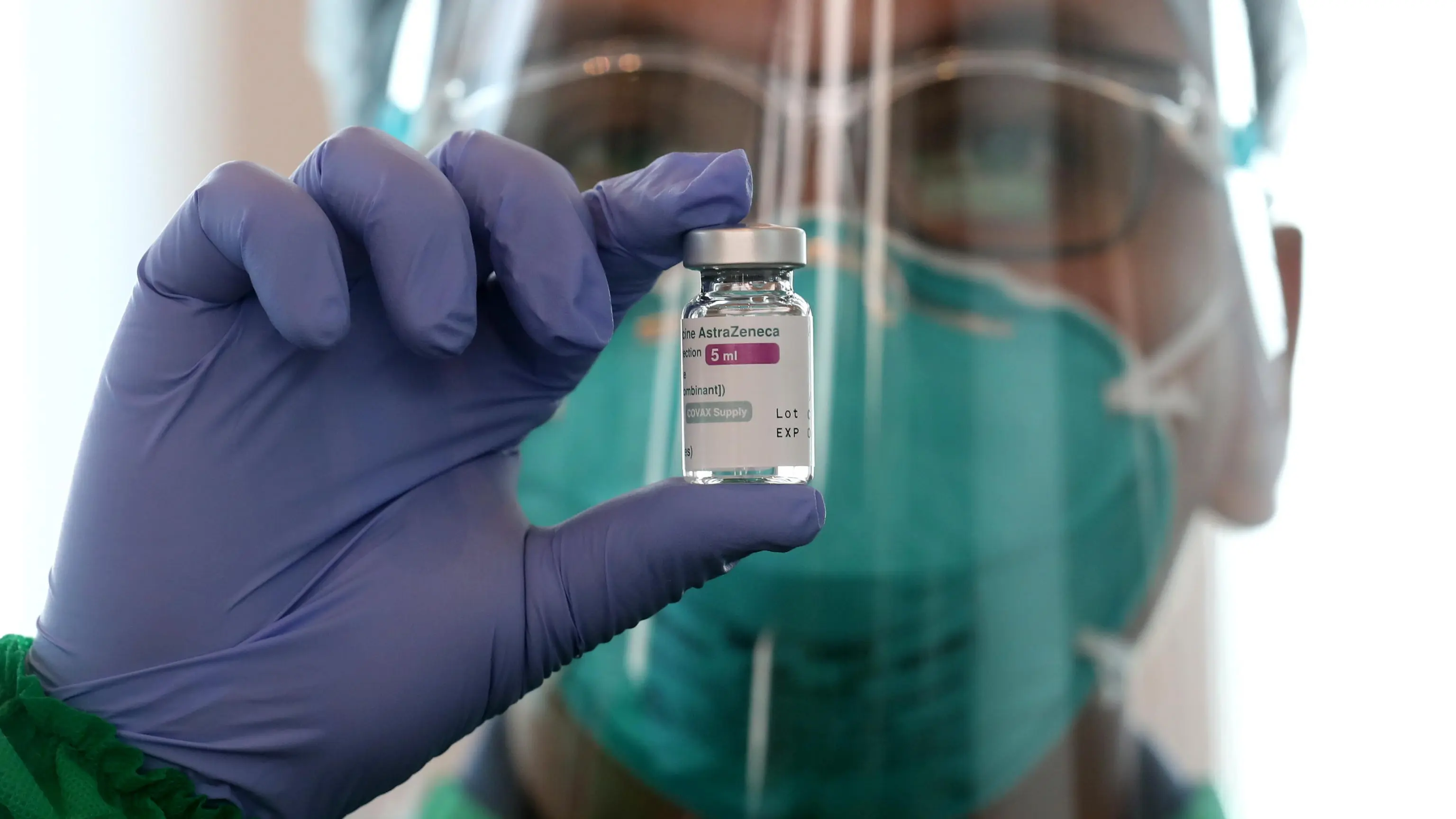 epa09254330 A health worker shows a vial of AstraZeneca vaccine during a COVID-19 vaccination drive at a shopping mall in Jakarta, Indonesia, 08 June 2021. Indonesia has recorded more than 1,800,000 COVID-19 cases since the beginning of the pandemic. EPA/Bagus Indahono