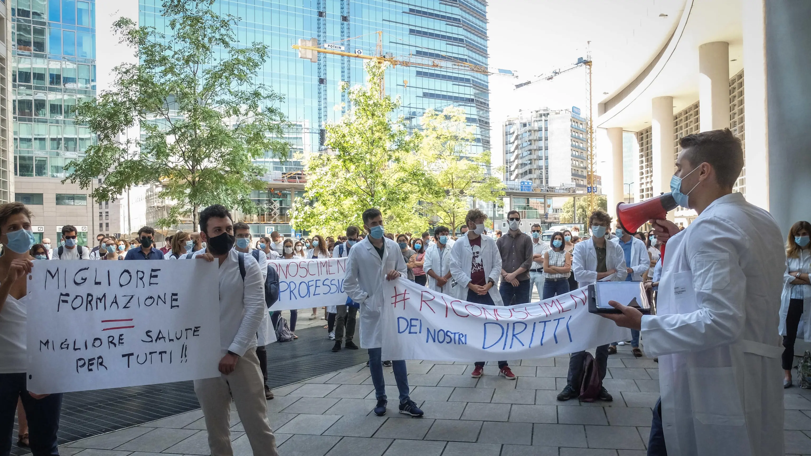 Graduating doctors protest under the building of the Lombardy Region for the recognition of their work during the Covid-19 coronavirus epidemic in Milan, Italy, 22 June 2020. Ansa / Matteo Corner