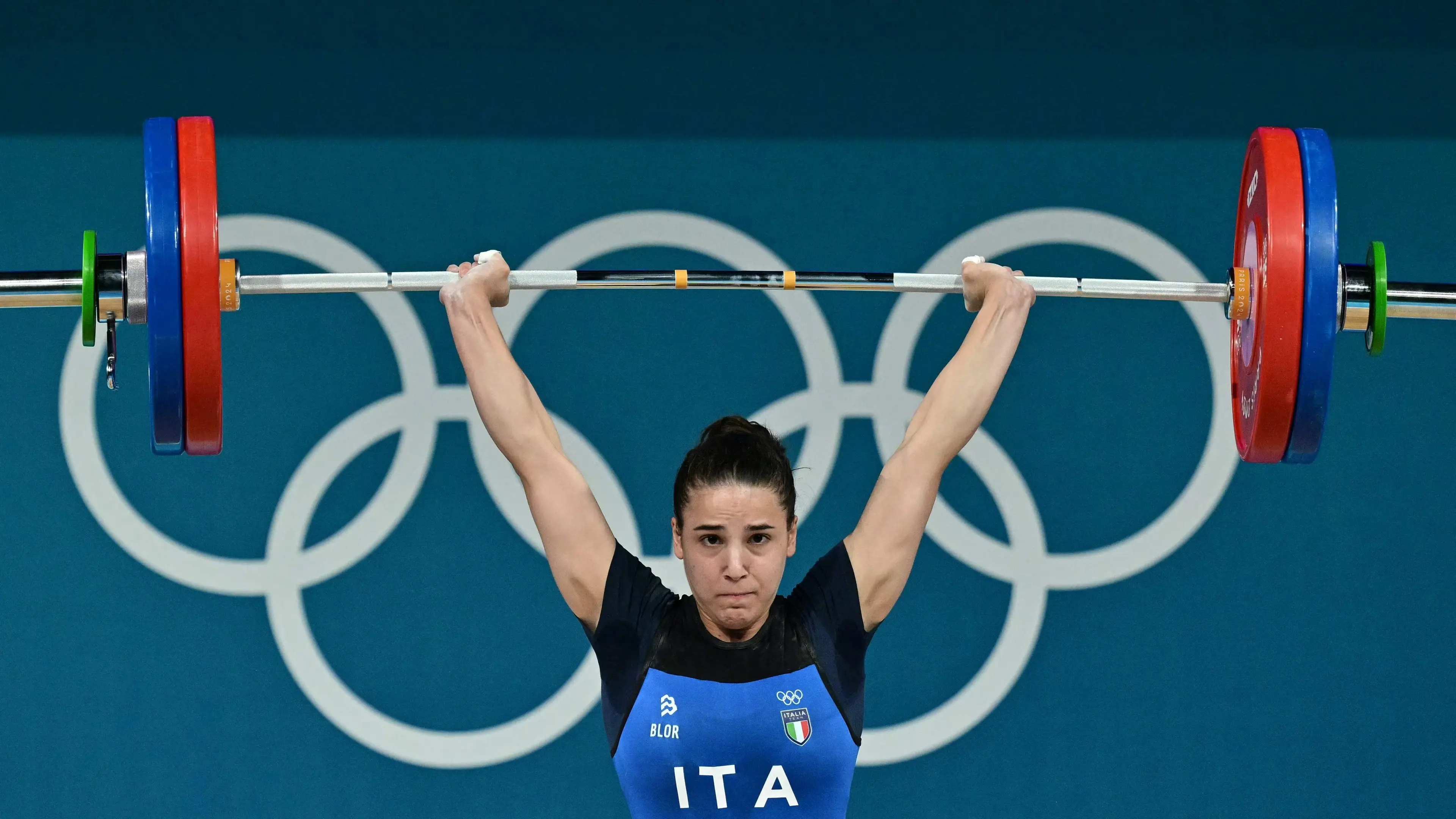 Italy's Lucrezia Magistris competes in the women's -59kg weightlifting event during the Paris 2024 Olympic Games at the South Paris Arena in Paris, on August 8, 2024. (Photo by Miguel MEDINA / AFP)